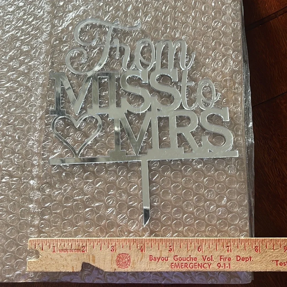 “From Miss to Mrs” cake topper